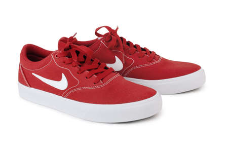 Moscow, Russia - August 10, 2020: NIKE red skaters sneakers isolated on white backgroundのeditorial素材