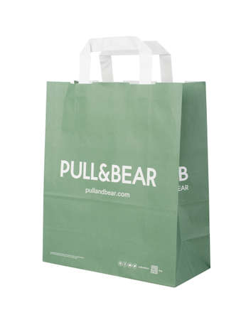 SAMARA, RUSSIA - September 13 2021: Pull & Bear green paper bag showing the of the spanish clothing and accessories retailer. Isolated on a white background.のeditorial素材