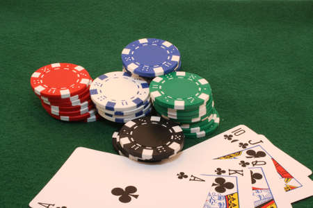 Royal Flush - Clubs with chips on green backgroundのeditorial素材