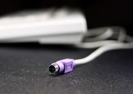 Keyboard connector with keyboard in the backgroundの写真素材