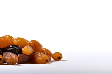 Heap of raisins on white background with copy space.の素材