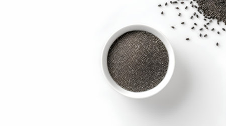 Chia seeds in bowl isolated on white background. Top view.の素材