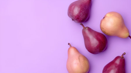 Ripe pears on purple background. Top view with copy spaceの素材