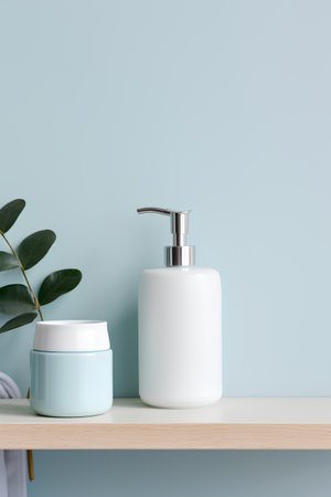Mockup of white cosmetic bottle with dispenser and green plant on shelf in bathroom, 3d renderの素材