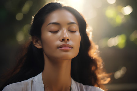Portrait of a beautiful young asian woman with closed eyes and closed eyes.の素材