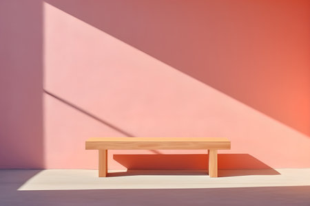Wooden bench on a pink wall with shadow from the sun. 3d renderingの素材