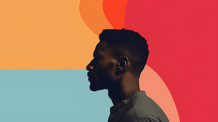 Young african american man looking away against colorful background with copy spaceの素材