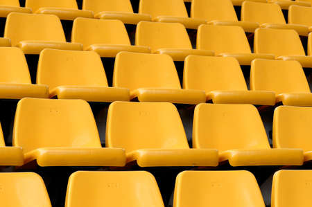 Empty yellow seatsの写真素材