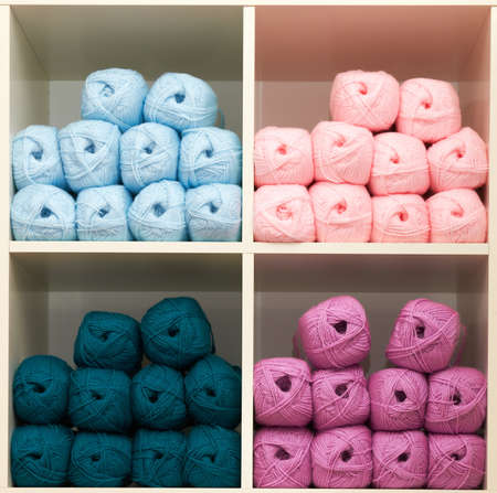 balls of wool on the shelf of a haberdasheryの写真素材