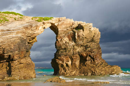 Las Catedrales beach, Ribadeo, Spain  Last ray of sun in the early morning before the rain の写真素材