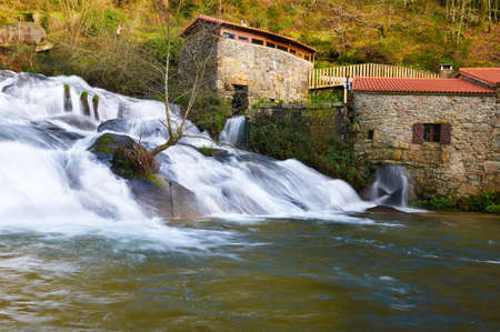 the waterfall of the Barosa River and some watermillsの写真素材