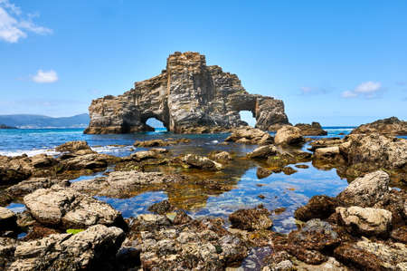 Pena Furada i a singular rock formation in Costa da Morte. Ortigueira. Coruna. Spainの写真素材