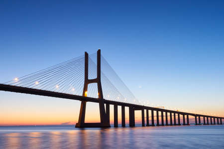 Long exposure shot of Vasco da Gama bridge in Lisbon before sunriseの写真素材