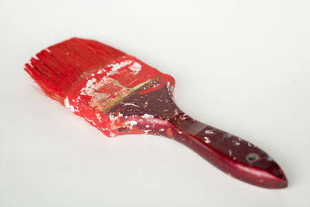 Dirty paint brushes on white background