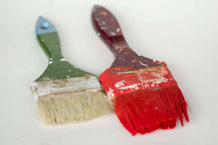 Dirty paint brushes on white backgroundの写真素材