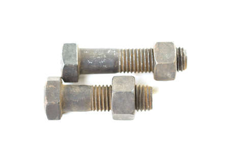 Closeup metal screw, bolt and nuts on white background.の写真素材