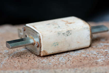 Ceramic electric fuse for large currents closeup on whiteの写真素材