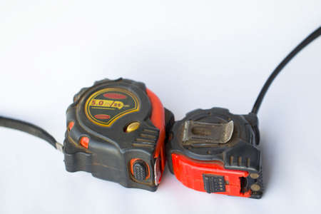 Old tape measure on a white backgroundの写真素材