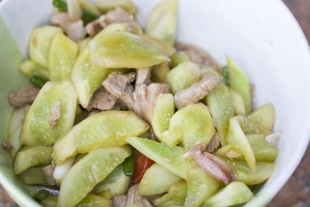 Fried pork with garlic pepper decorate cucumberの写真素材