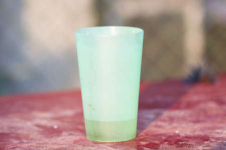 Green plastic cupの写真素材