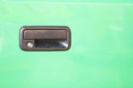 Color horizontal shot of a car door handle. (car, paint, automotive)の写真素材