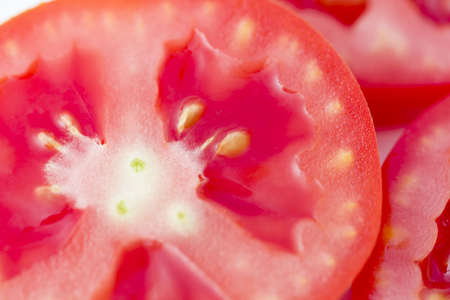 Slice tomato isolated on the white background. (sliced)の写真素材