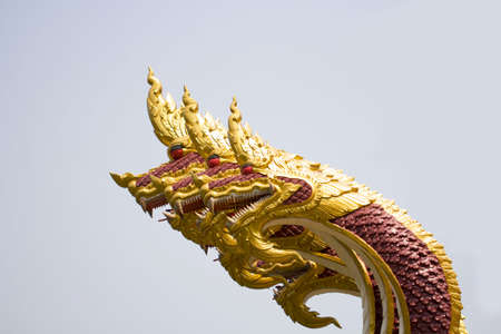 close up of naga head statue protecting the entrance to Thai templeの写真素材