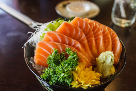 Sliced salmon sashimi served on cupの写真素材