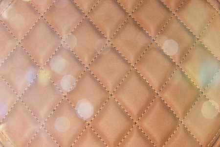 Brown Buttoned luxury leather with bokeh lightingの写真素材