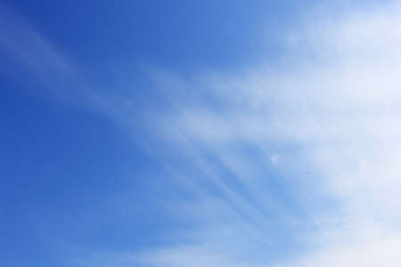 Blue sky with lining cloudの写真素材