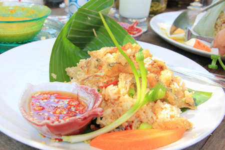 Thai cuisine fried rice with crispy fishの写真素材