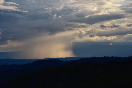 Tunderstorm, Cloudburst Above the natural forest in the middle of the valley. concept bad weather...