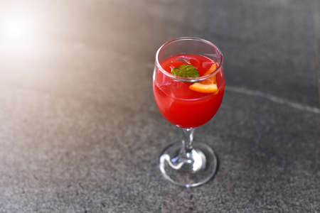 A beautifully decorated welcome drink or fruit juice of Prosecco fruit punch with oranges and mint leaves inside serves as a welcome drink at any party, reception, wedding or banquet. selected focusの写真素材