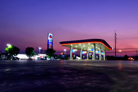LOEI, Thailand - March 22, 2023 : PTT gas station in the evening sunlight with colorful sky....