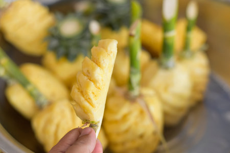 Sliced delicious ripe pineapple yellow, pieces of sweet and juicy pineapple cut on a cutting board.