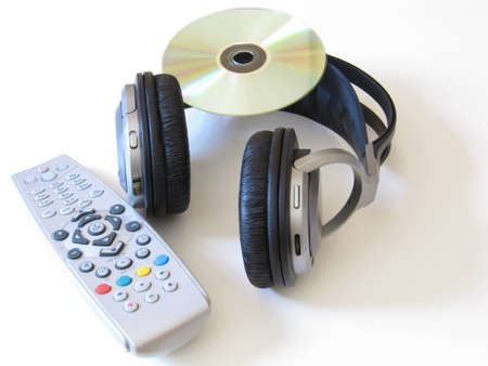 A set of headphones, a CD and a remote controlの写真素材