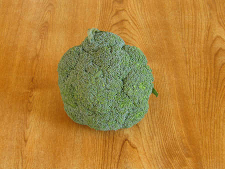 Some fresh broccoli left on a tableの写真素材