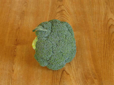 Some fresh broccoli left on a tableの写真素材