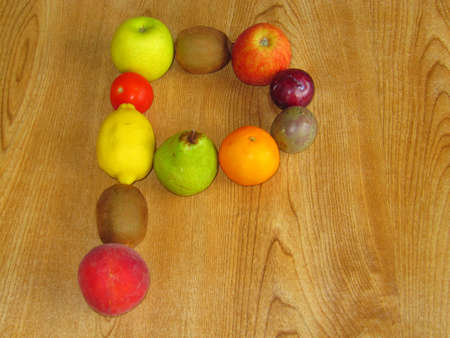 A selection of fruit in the shape of the letter Pの写真素材