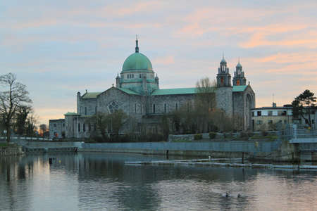 Galway Cathedral with a section of the River Corrib in the foregroundの写真素材