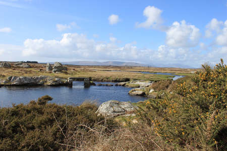 A rural landscape with a rock footbridgeの写真素材