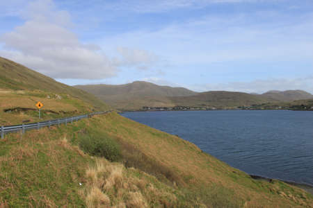 A view of Killary Fjord, Ireland with the village of Leenaneの写真素材