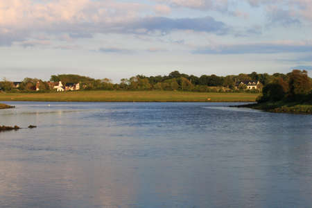 An evening river scene on an Irish riverの写真素材