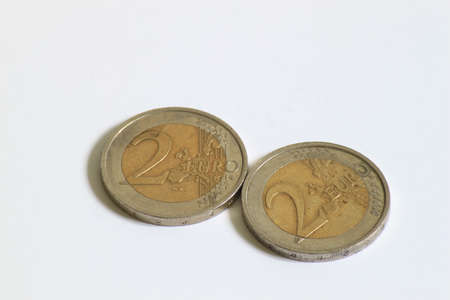 2 used 2 Euro coins displayed side by side の写真素材