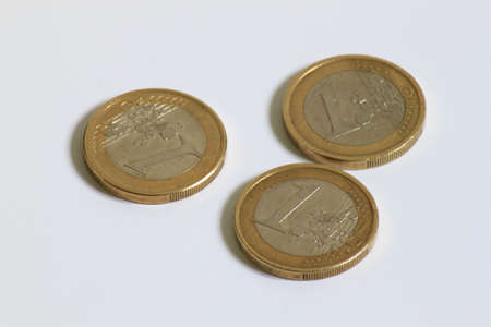 3 used 1 Euro coins displayed side by side の写真素材