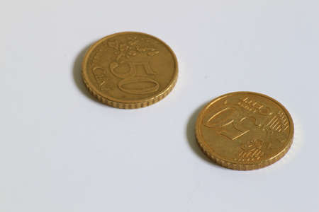 2 used 50 cent Euro coins displayed side by side の写真素材