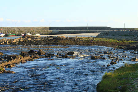 The Owenboliska River entering the sea at Spiddal, Co. Galway, Ireland.の写真素材