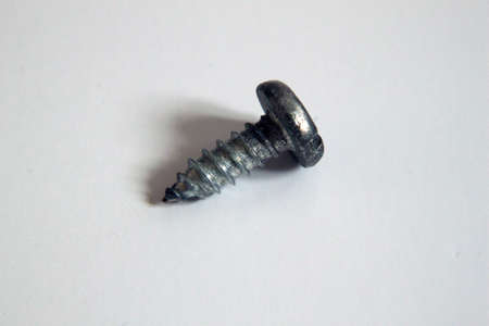 A photograph of a screw on a white backgroundの写真素材
