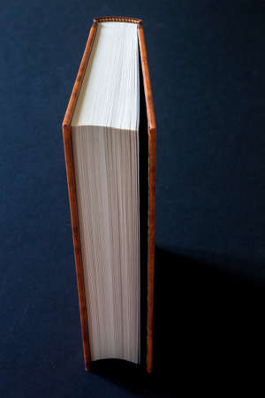 A book displayed on a dark backgroundの写真素材