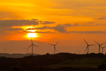 Sunset with wind turbines at Barna Co. Galway Ireland.